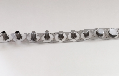 Part by progressive die